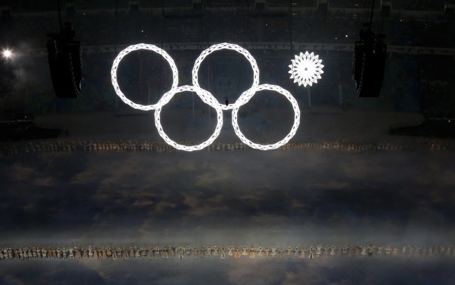 The Olympic rings (one did not fully open), a symbol of the peaceful unification of the world through the spirit of sport. 