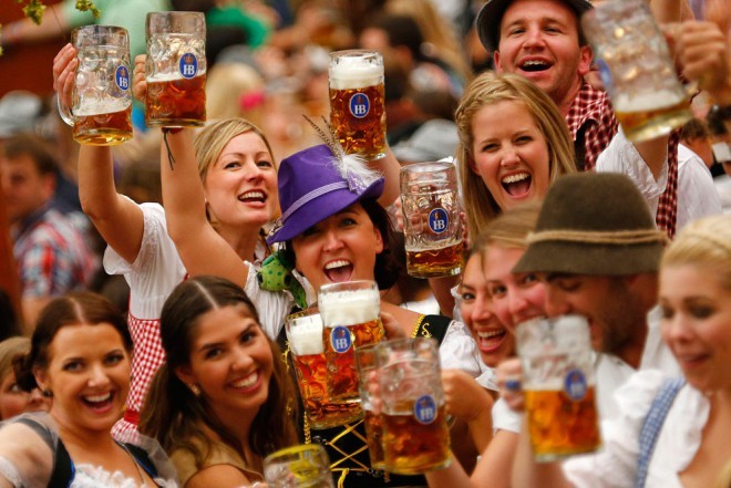 A toast of young visitors to Oktoberfest in Munich.  