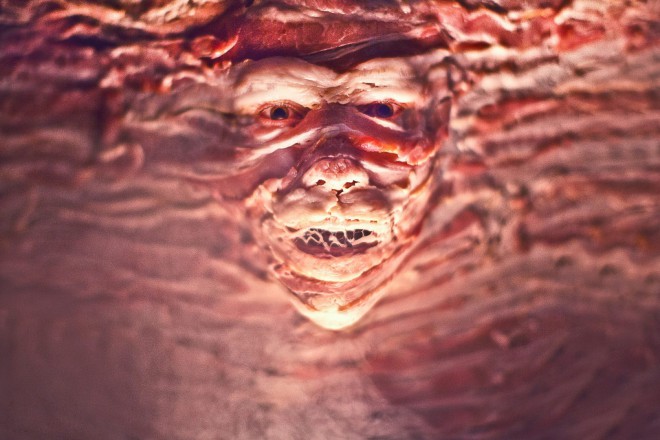 A face covered in bacon looks pretty creepy.