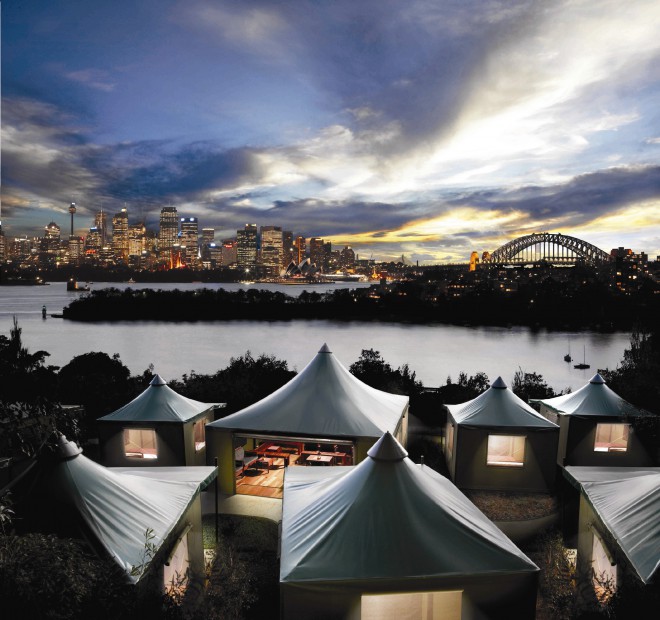 Overlooking the harbor at Sydney's Taronga Zoo, luxury safari tents have been set up on the waterfront.