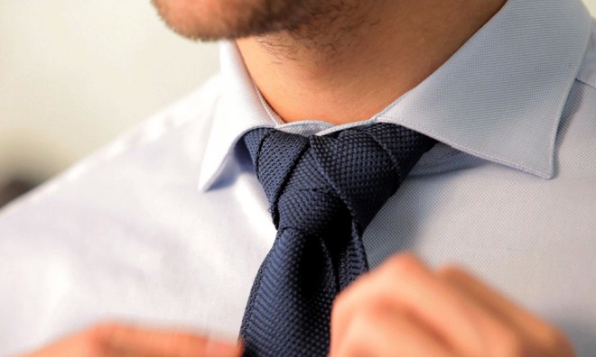 Tying a tie is something every businessman must master.