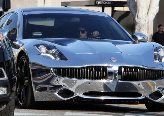 Although Justin Bieber is still very young, he can afford just about any car. Here we see it in the Fisker Karma.